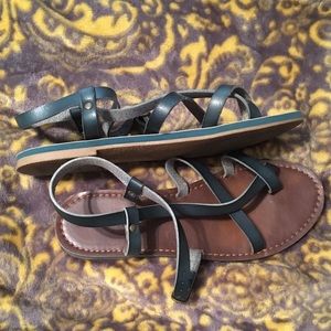 Green and brown strap sandals.